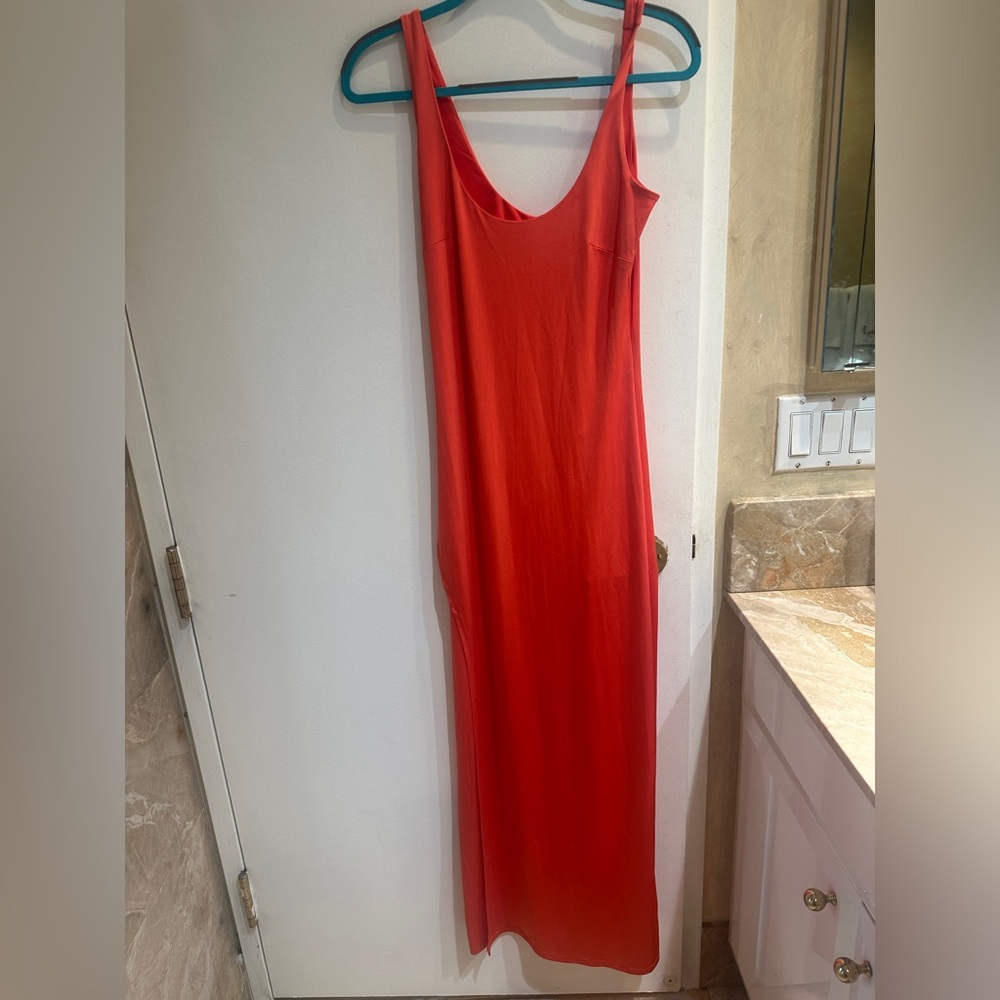 L’agence orange dress in sz xsmall but has a lot of stretch